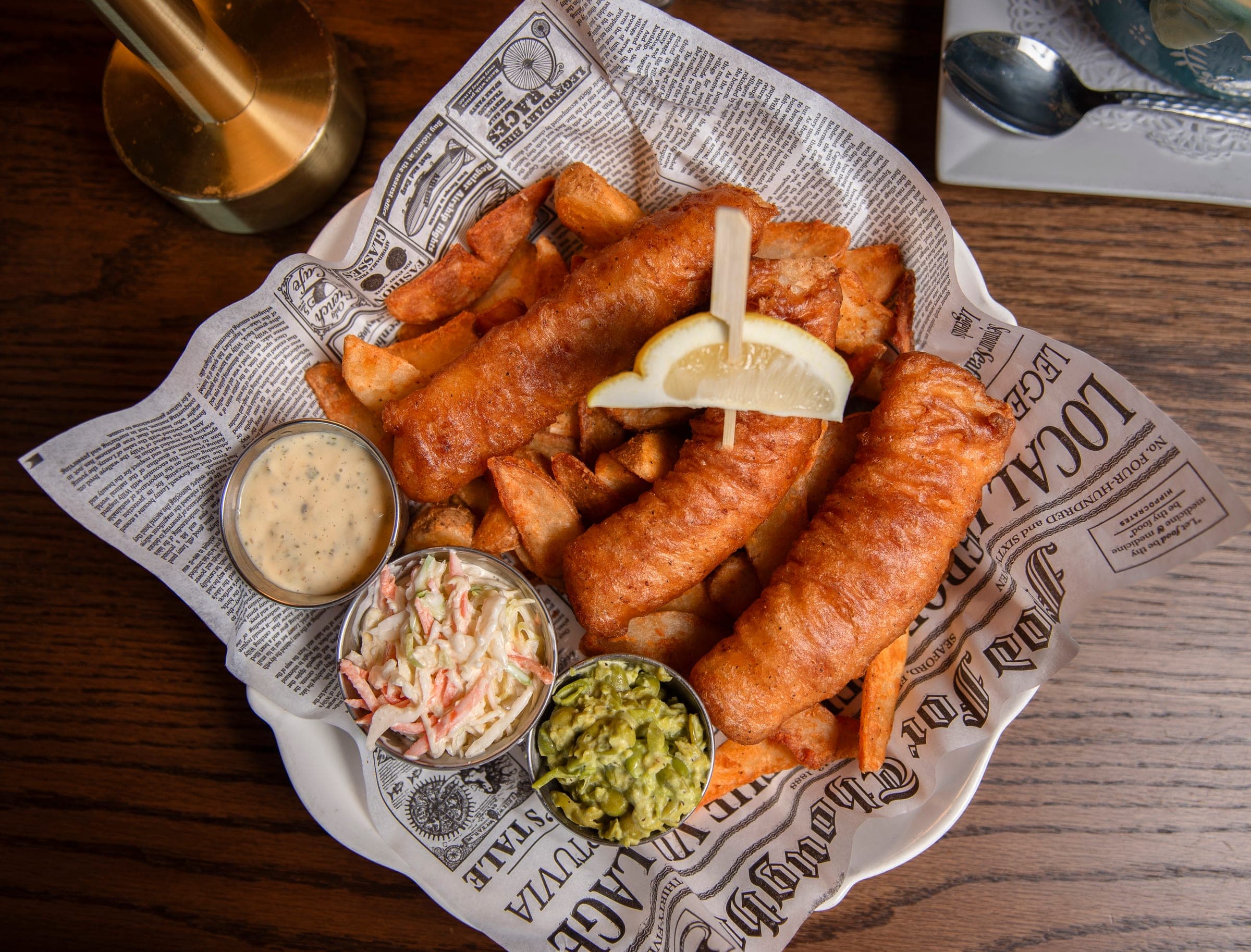 Beer-battered fish and chips in a newspaper basket at The Crown Tavern in Glen Mills, PA