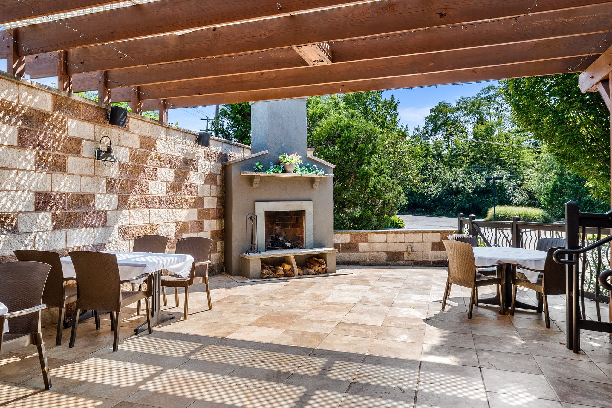 The garden patio with outdoor fireplace and dining at Crown Tavern in Glen Mills, PA